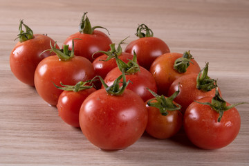 fresh tomatoes set on wooden background