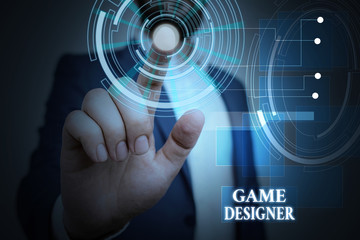Handwriting text Game Designer. Conceptual photo Campaigner Pixel Scripting Programmers Consoles 3D Graphics Male human wear formal work suit presenting presentation using smart device