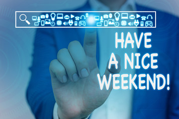 Conceptual hand writing showing Have A Nice Weekend. Concept meaning wishing someone that something nice happen holiday Male wear formal suit presenting presentation smart device