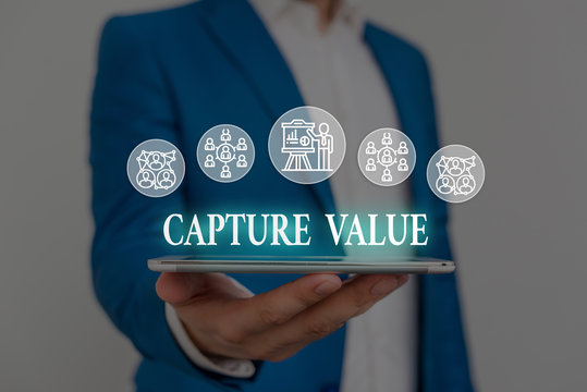 Text sign showing Capture Value. Business photo showcasing Customer Relationship Satisfy Needs Brand Strength Retention Male human wear formal work suit presenting presentation using smart device