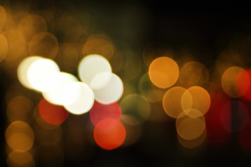Fototapeta premium Blurry background image of defocused golden color abstract city street lights at night