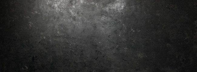 Rough, dark stone background lit by spotlight background