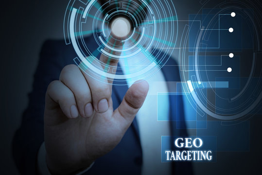 Handwriting text Geo Targeting. Conceptual photo Digital Ads Views IP Address Adwords Campaigns Location Male human wear formal work suit presenting presentation using smart device
