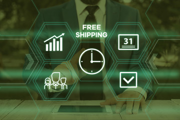 Handwriting text writing Free Shipping. Conceptual photo Freight Cargo Consignment Lading Payload Dispatch Cartage Male human wear formal work suit presenting presentation using smart device
