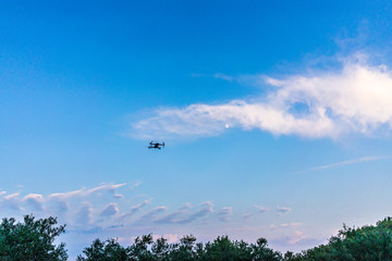 Drone flying at sunset