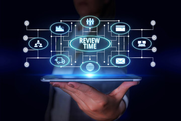 Word writing text Review Time. Business photo showcasing to think or talk about something again Set schedule to review Woman wear formal work suit presenting presentation using smart device