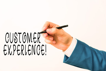 Text sign showing Customer Experience. Business photo showcasing product of interaction between organization and buyer Isolated hand above white background. Pointing pen in the hand on white