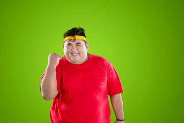 Fototapeta premium Fat man wears sportswear with happy expression