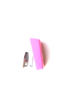 Small pink stapler isolated on white background.
