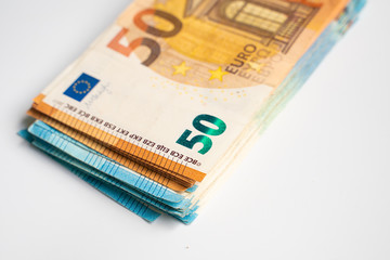 Pile bundle of euro bills money note on white background