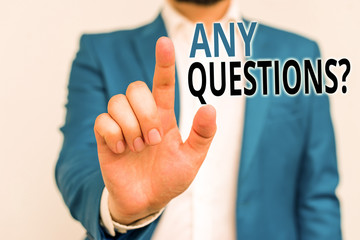 Word writing text Any Questions Question. Business photo showcasing you say write order to ask demonstrating about something Businessman in blue suite and white shirt pointing with finger in empty