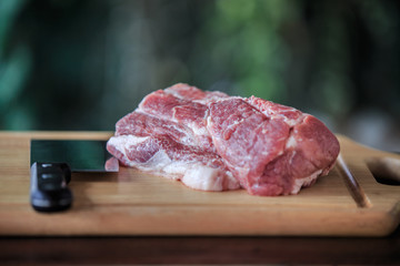 Close up raw pork on cutting board