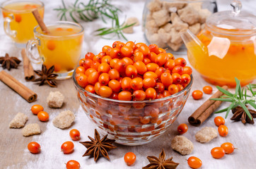 Raw sea buckthorn berries in a glass dish