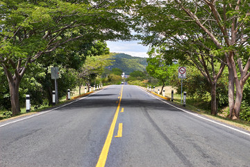 Fototapeta premium panoramic view of American road during the day without vehicles