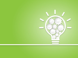 Creative Idea Concept. White light bulb and gear wheel on green background.