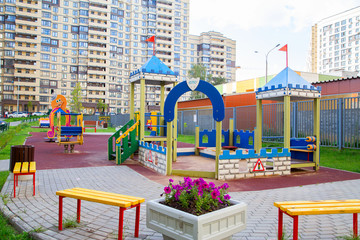 Fototapeta na wymiar Modern Playground in the courtyard of the neighborhood.Horizontally.