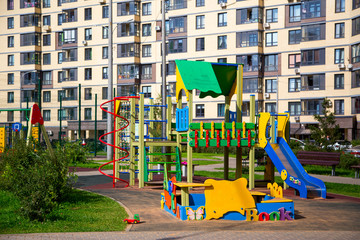 Fototapeta na wymiar Modern Playground in the courtyard of the neighborhood.Horizontally.