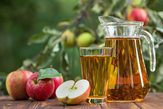 apple juice in glass and jug