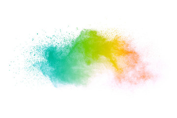 Freeze motion of colorful color powder exploding on white background.  Paint Holi.
