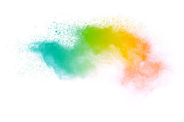 Freeze motion of colorful color powder exploding on white background.  Paint Holi.