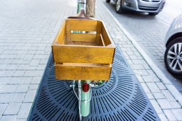 Bicycle with wood crate box on back in city street