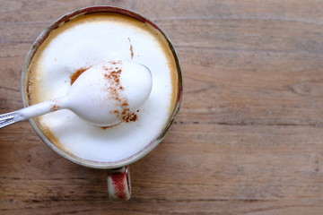 cup of coffee on wooden table