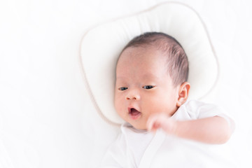 Baby lying on a crib