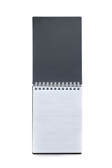 Top view of an open notebook with a spiral spring with a black textured cover and checkered sheets isolated on a white background