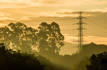 High voltage electric post with sunlight in The morning, Chiangmai Thailand