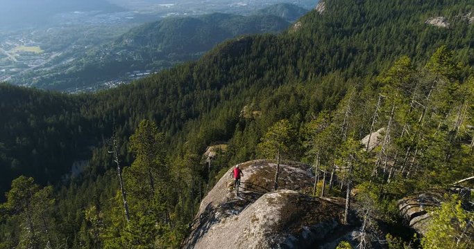 Mountain Biker Riding Next To Cliff