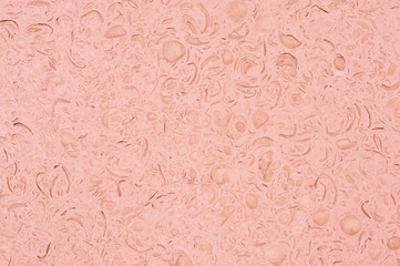 Organic texture of natural stone pastel coralline color tone with traces of shells. Natural background