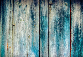 Old faded paint on wooden boards