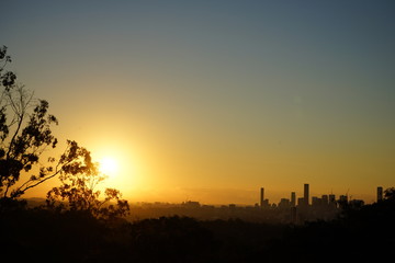 sunrise, golden hue over the city 