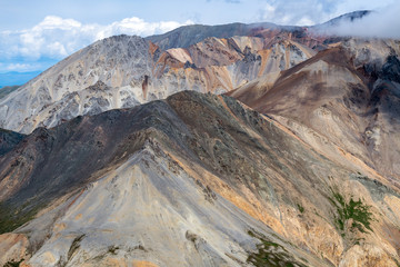 Colorful mountains in the clouds in Kluane National Park, Yukon, Canada
