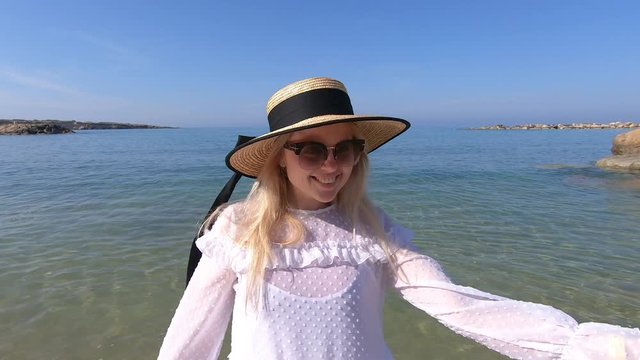 Woman travel to Cyprus and relax near coral bay beach