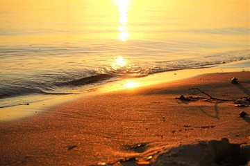 sun setting over calm water