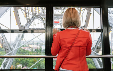 A woman rides on a ferris wheel in Vienna, Austria.