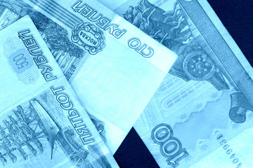 Banknote background from Russian rubles close up. Blue color toned