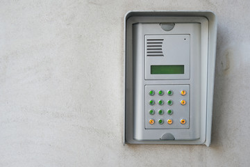 intercom on exterior wall of residential building