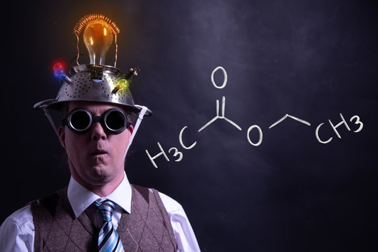 Nerd presenting handdrawn chemical formula of ethyl acetate