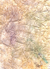 Beige, purple, brown and green crumpled paper. Wrinkled  background. Dirty color abstract wallpaper. Colorful craft page.