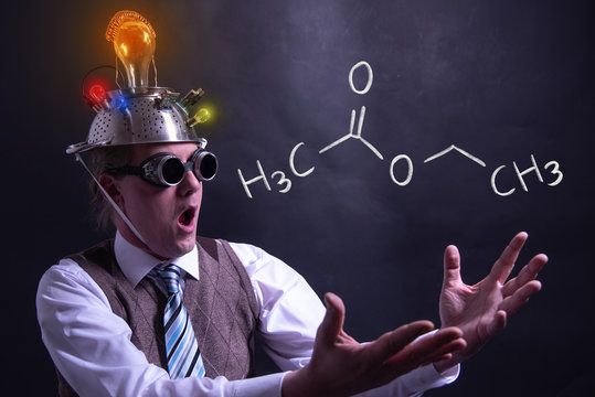 Nerd presenting handdrawn chemical formula of ethyl acetate