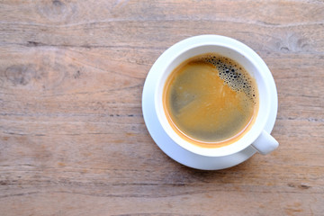 cup of coffee on wooden table