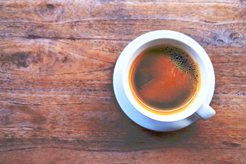 cup of coffee on wooden table