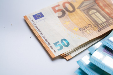 Pile bundle of euro bills money note on white background