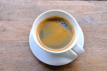 cup of coffee on wooden table