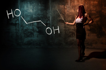 Sexy girl or secretary or female student presenting handdrawn chemical formula of ethylene glycol