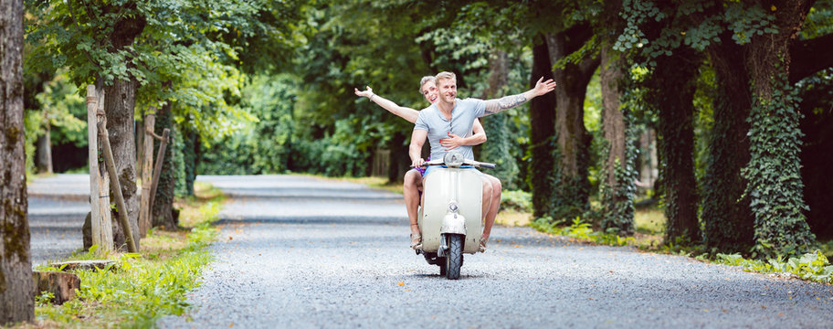 Young couple on retro scooter