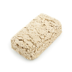 Sunflower halva isolated on white background. Sweet halva dessert slices.