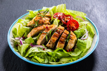 Caesar salad on stone table